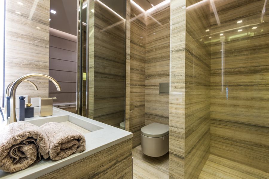 Elegant warm marble bathroom used to illustrate an imaginary after-dinner escape