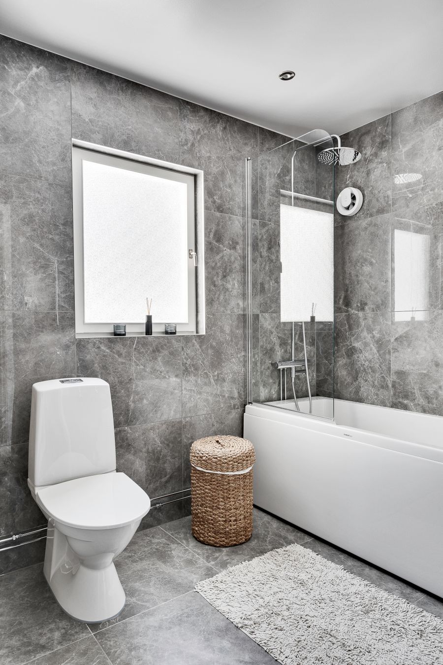 Clean gray marble bathroom used to illustrate an imaginary calm private retreat